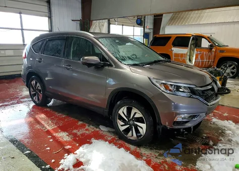 2016 Honda Cr-V Touring z USA, uszkodzony, nr VIN 5J6RM4H96GL087945